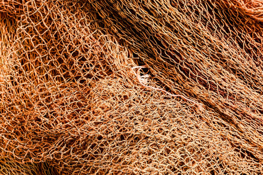 a close up of a bunch of orange fishing nets photo