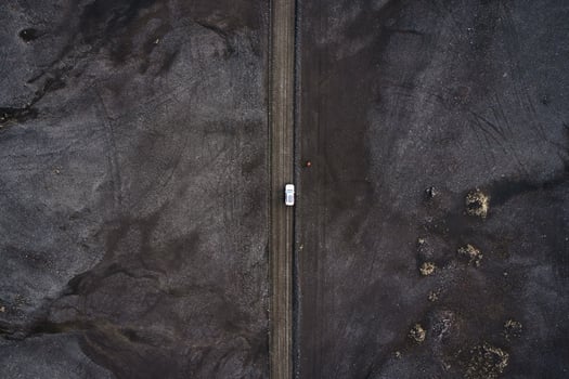 Black volcanic desert on wilderness with 4x4 vehicle car parked in Landmannalaugar at Icelandic highlands photo