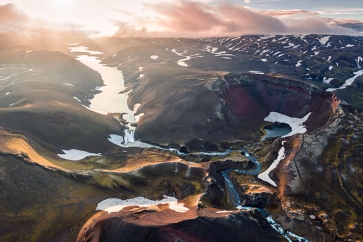 Aerial view of sunset over volcanic crater and glacier stretches through the central highlands of iceland on summer photo