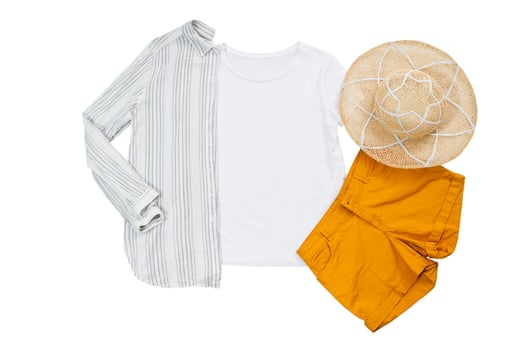 White closeup t shirt mock up flat lay isolated on white background. Summer accessories. Top view and copy space. Mockup t-shirt and summertime. Template blank shirt. photo