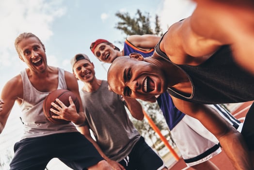 Funny selfie Self portrait of young men in sports clothing smiling while standing outdoors photo
