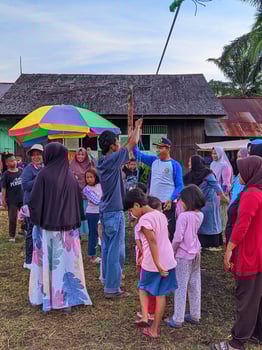 the excitement of adults and children taking part in a cracker eating competition to enliven the independence day of the republic of Indonesia, East Kalimantan, Indonesia August 13, 2022 photo