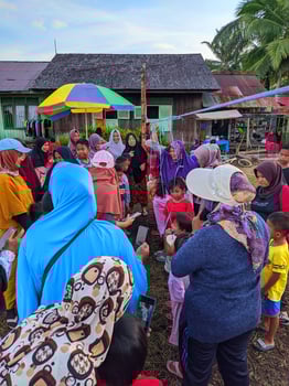 the excitement of adults and children taking part in a cracker eating competition to enliven the independence day of the republic of Indonesia, East Kalimantan, Indonesia August 13, 2022 photo
