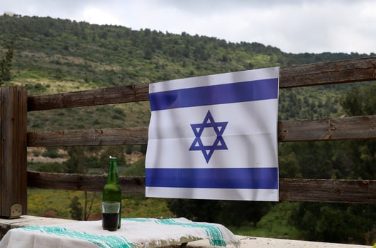 The blue and white Israeli flag with the Star of David. photo