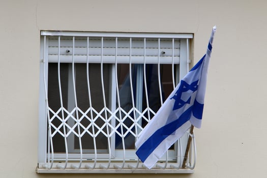 The blue and white Israeli flag with the Star of David. photo