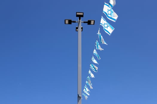 The blue and white Israeli flag with the Star of David. photo
