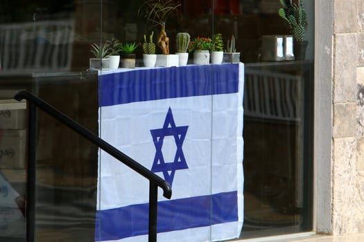 The blue and white Israeli flag with the Star of David. photo