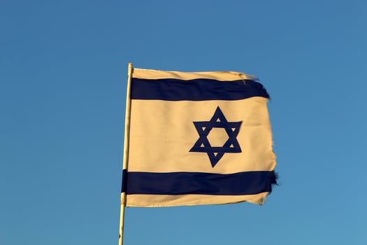 The blue and white Israeli flag with the Star of David. photo