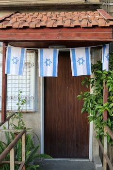 The blue and white Israeli flag with the Star of David. photo