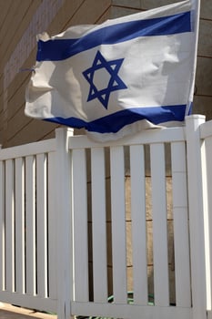 The blue and white Israeli flag with the Star of David. photo