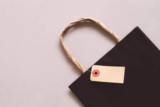 Shopping bag with blank sale tag, copy space,  shopping concept photo