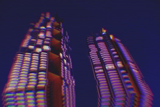 View of modern buildings in the city night background with digital glitch effect photo