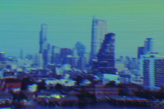 View of modern buildings and cityscape background with digital glitch effect photo