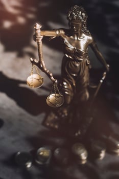Business and lawyers discussing contract papers with brass scale on desk in office. Law, legal services, advice, justice and law concept picture with film grain effect photo