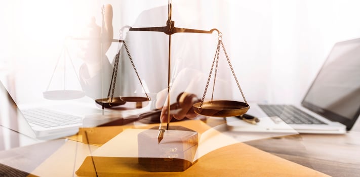 justice and law concept.Male judge in a courtroom on wooden table and Counselor or Male lawyer working in office. Legal law, advice and justice concept. photo