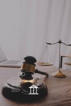justice and law concept.Male judge in a courtroom on wooden table and Counselor or Male lawyer working in office. Legal law, advice and justice concept. photo