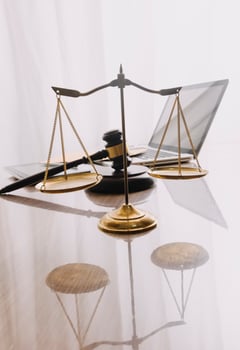 justice and law concept.Male judge in a courtroom on wooden table and Counselor or Male lawyer working in office. Legal law, advice and justice concept. photo