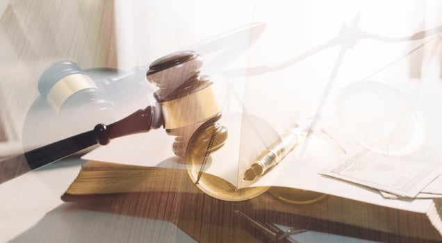 justice and law concept.Male judge in a courtroom on wooden table and Counselor or Male lawyer working in office. Legal law, advice and justice concept. photo