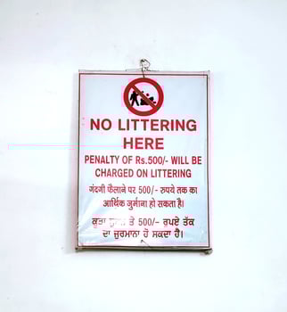 Penalty board is hanging at indian railway platform photo