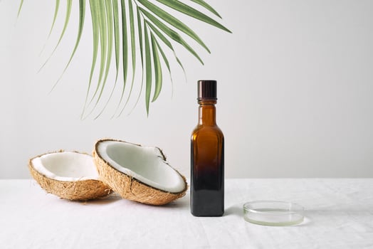 Spa cosmetics in brown glass bottles on gray concrete table. Copy space. Beauty blogger, salon therapy, minimalism concept photo