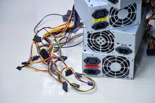 Computer power supply stacked on the floor old condition photo