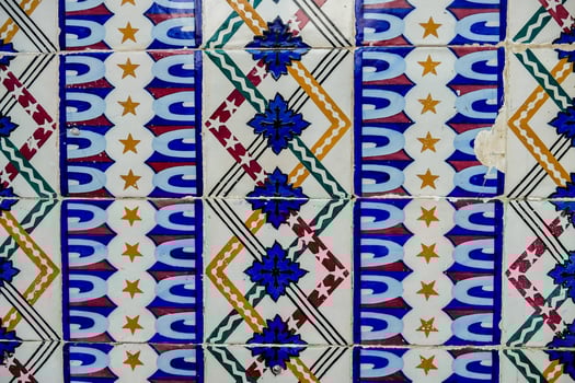 a close up of a tile with a flower design photo