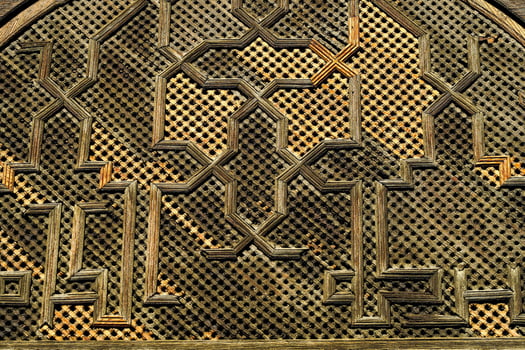 an old wooden window with intricate designs photo