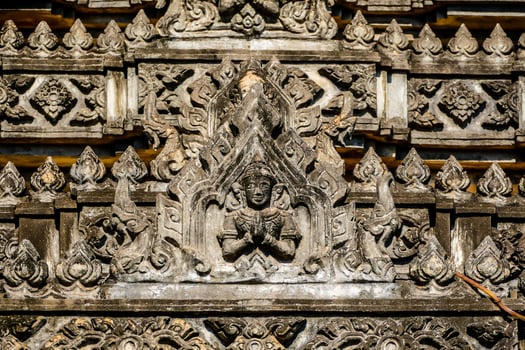 an ornate wall with carvings photo
