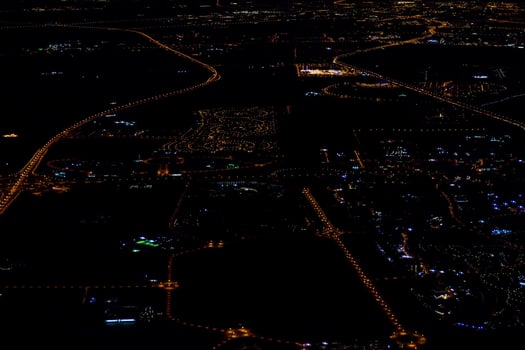 an aerial view of a city at night photo