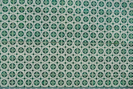 a green and white patterned wall photo