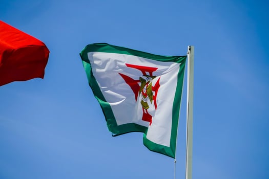 a flag against a blue sky photo