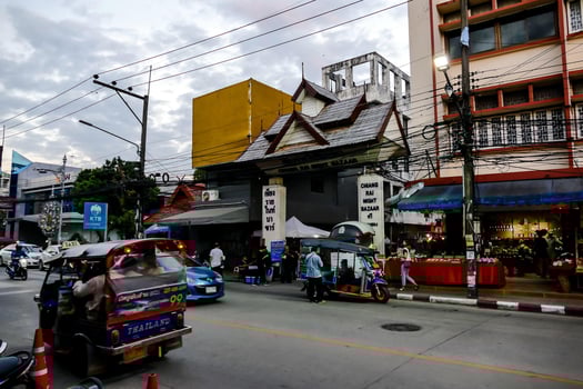 a city street with cars and motorcycles on it photo