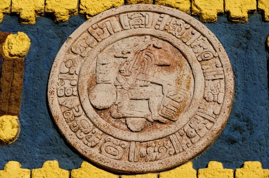 A round Mayan plaque photo