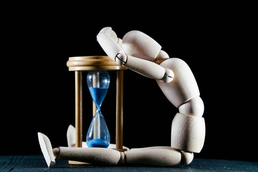 Wooden mannequin on dark background photo