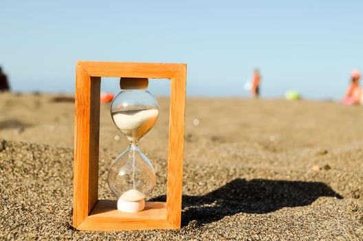 Hourglass in the sand photo