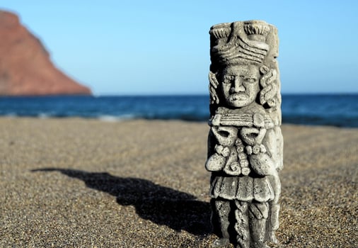 Small statue in the sand photo