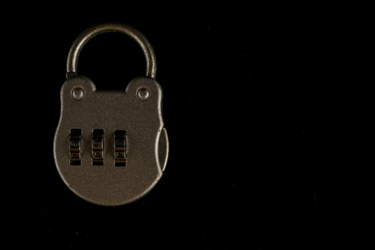 Padlock on black background photo