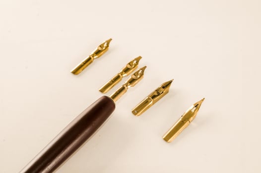 Fountain pen on light background photo