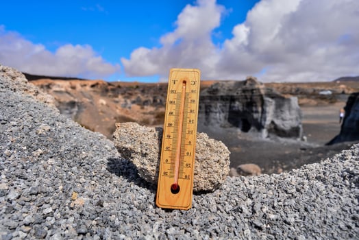 Thermometer on a rock photo