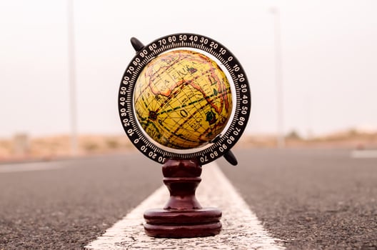 Globe miniature on the ground photo