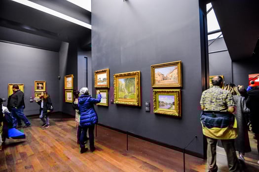 Unidentified people and artwork in the Musee d Orsay in Paris, France, circa October 2022 photo