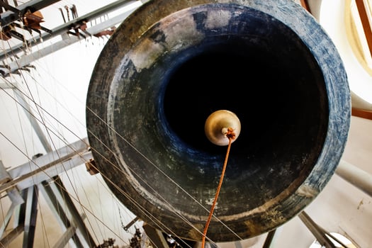 Close-up view of metal orthodox church bells in tower. photo