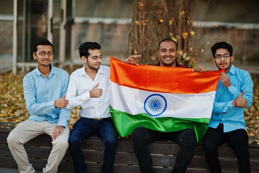 Group of four south asian indian male with India flag. photo
