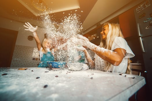 Mother with kids on kitchen photo