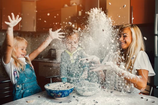 Mather with kids at kitchen photo