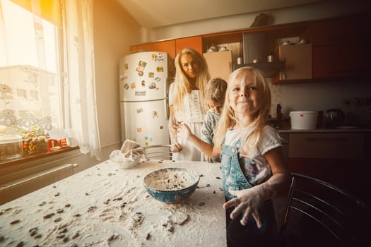 Mother with kids on kitchen photo