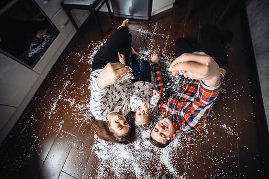 Happy family playing together on the floor photo