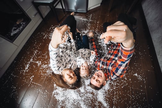 Happy family playing together on the floor photo