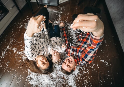 Happy family playing together on the floor photo