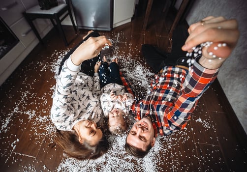Happy family playing together on the floor photo